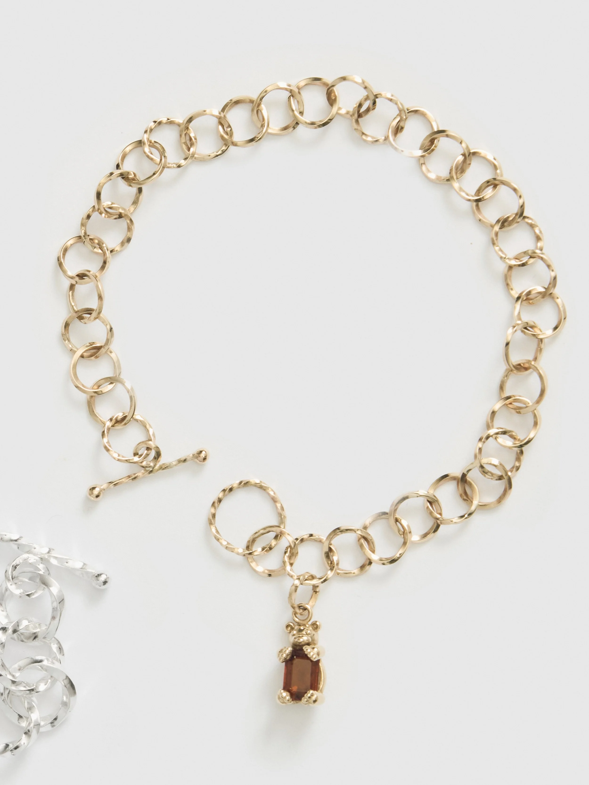 Gold bracelet with a small animal charm
